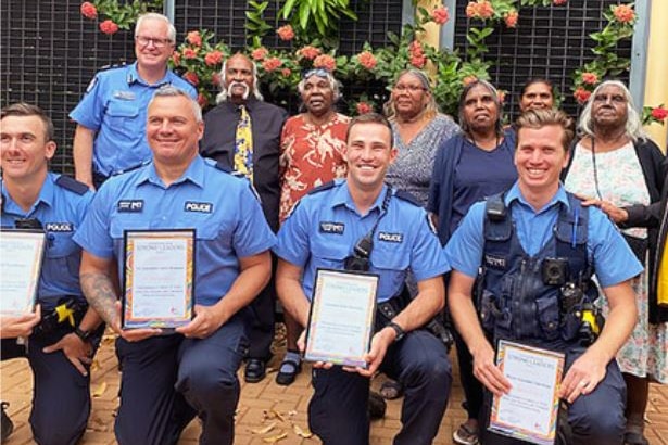 A group of four police officers pictured with their awards