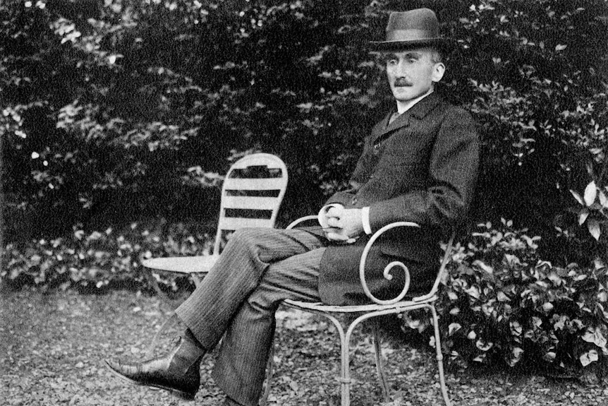 French philosopher Henri Bergson sitting on a garden chair