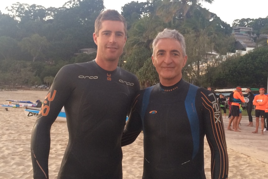Father and son Mark and Dane prepare to tackle the 10-kilometre swim at the Noosa Ultraman.