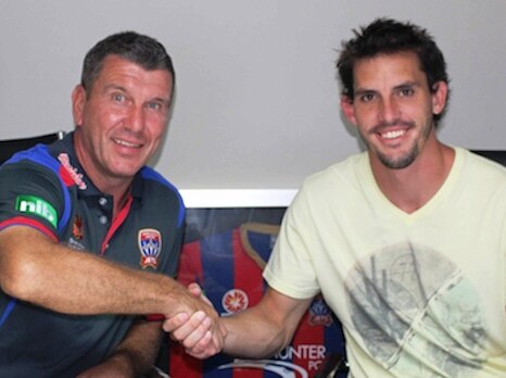 Newcastle Jets goalkeeper Ben Kennedy (right) with coach Phil Stubbins after signing a two-year contract extension.