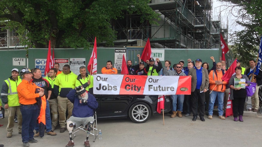 Workers and union representatives have protested at the front of the construction site.