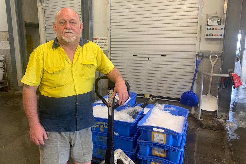 Andrew Brown with a trolley loaded with fish in ice