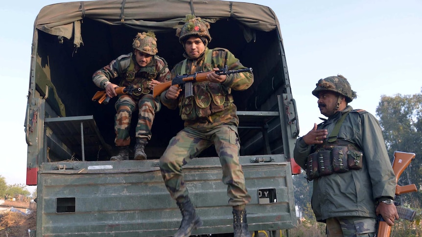 Indian troops disembark truck at Pathankot air base