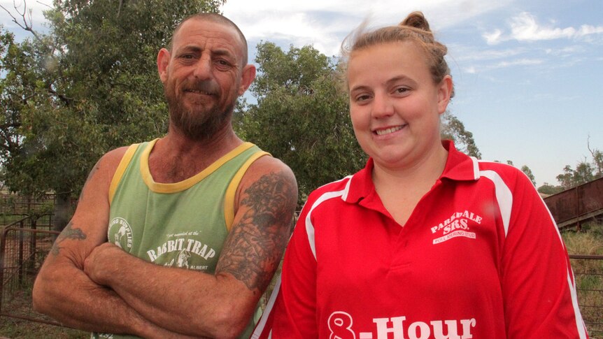 Dwayne and Teagan Barnes  stand outside a central west NSW shearing shed.