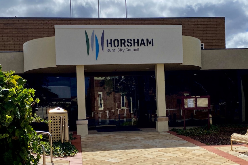 The front of Horsham council's chambers on a partly cloudy day.