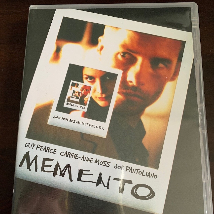 A DVD cover showing polaroid photos and the title of the film, Memento