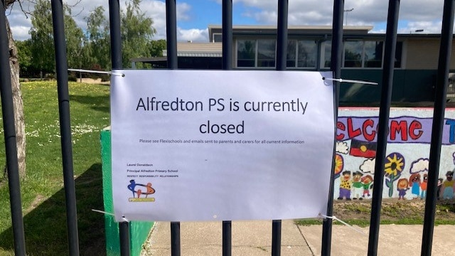 A sign at a closed school