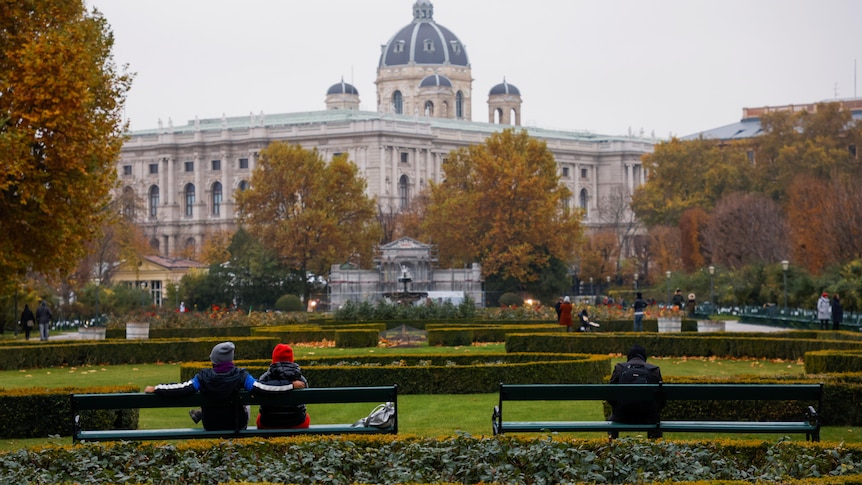 People sit in a public garden 