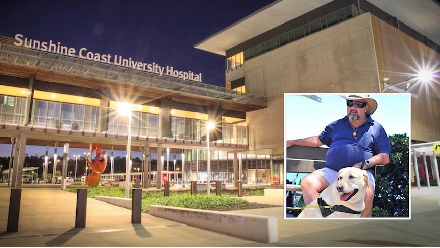 A man with a guide dog sitting on a bench, inset onto an image of the hospital lit up at night.
