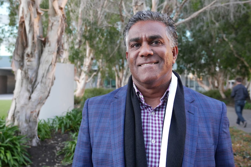 indigenous gentleman smiles. I hate to describe him by race but it is important for the story