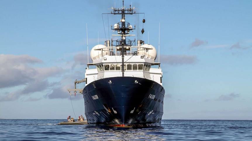 Large research vessel with 'Falkor' written on the hull