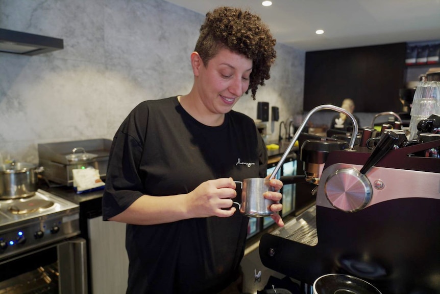 a woman making coffee
