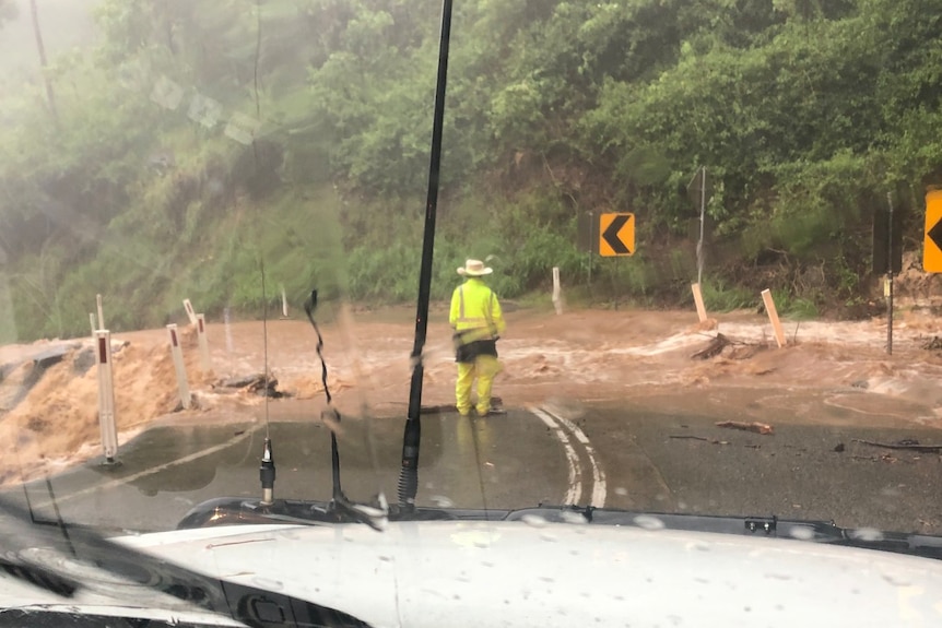 Floodwater gushes over Mackay road