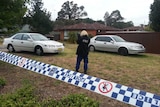 Police officer photographs shooting scene at Blacktown.