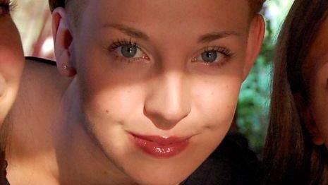 A close-up picture of a young blond woman