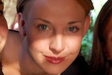 A close-up picture of a young blond woman