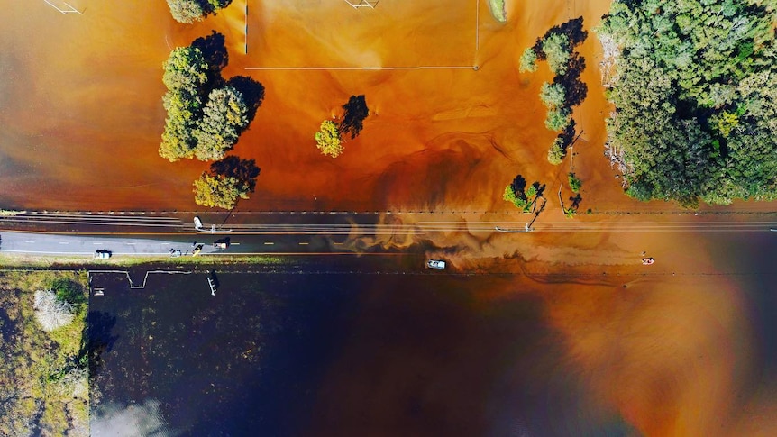 An aerial view of the flooded road.