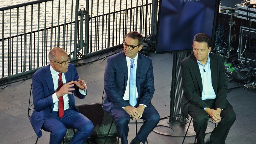 Jay Weatherill, Steven Marshall and Nick Xenophon on stage during the leaders' debate.