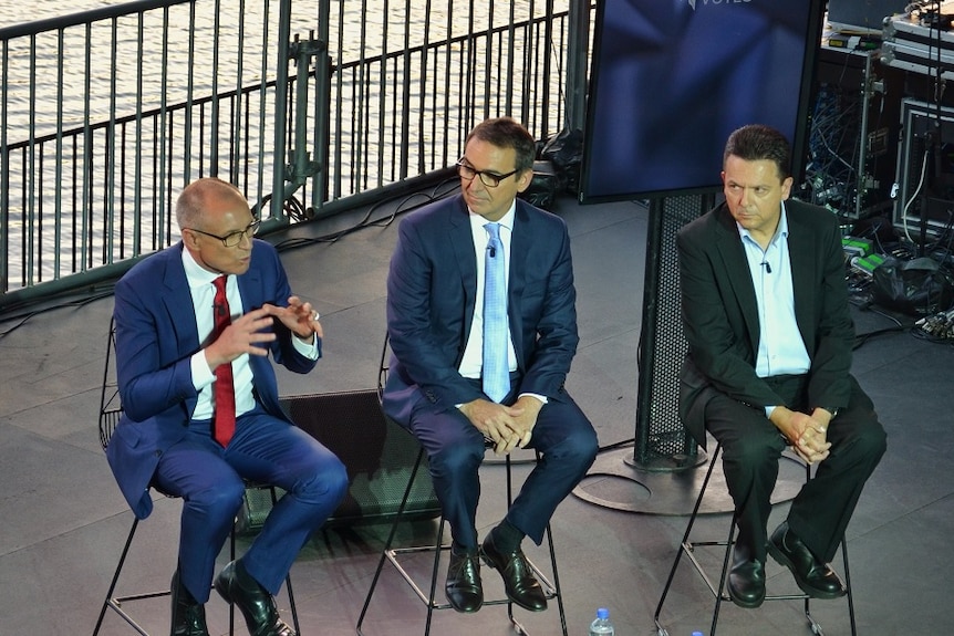 Jay Weatherill, Steven Marshall and Nick Xenophon on stage during the leaders' debate.