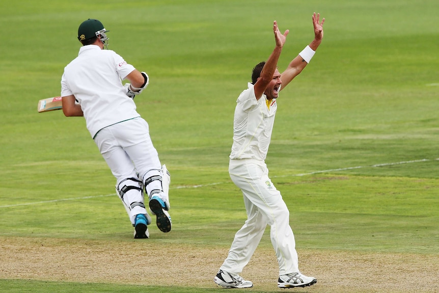 Australia's Ryan Harris takes the wicket of Graeme Smith against South Africa in Port Elizabeth.