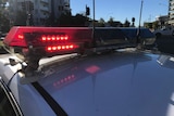 Red lights on top of Queensland police car in Brisbane street.
