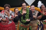 A group of Leitis dance wearing traditional skirts