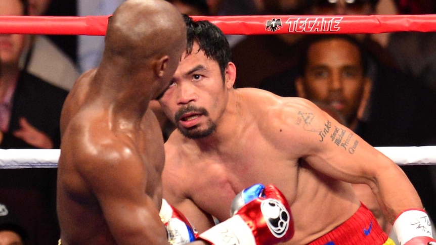 Manny keeps an eye on Floyd