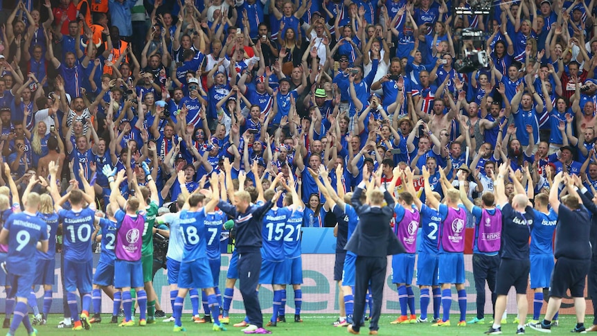 Iceland players celebrate with fans after beating England