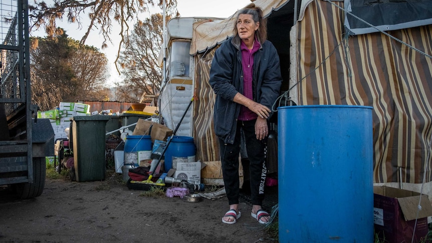 Ronnie Eagles outside her caravan on her burnt out property.