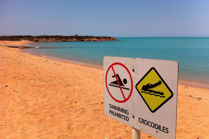 A no swimming sign on a beach in Broome.