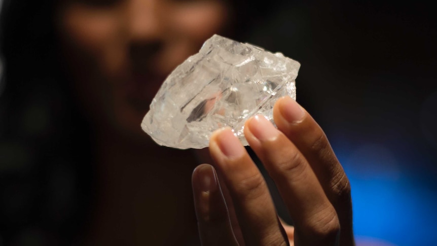 A model holds the 1,109 carat Lesedi La Rona diamond at Sotheby's in New York.