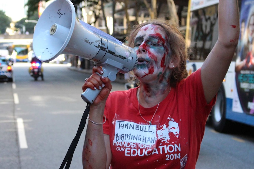 'Living zombie' marches in student protest