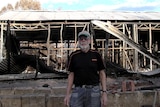 John Harris outside his destroyed Yarloop home