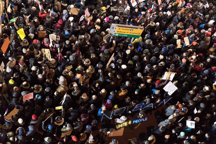An aerial shot of protesters at JFK international airport protesting trump's ban on travel