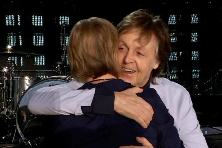 Paul McCartney hugs Leigh Sales at the end of the interview
