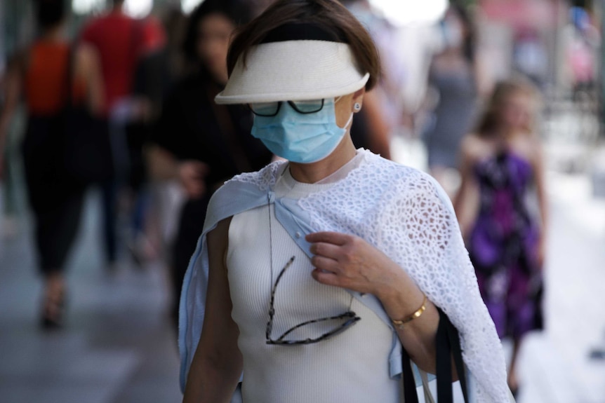 A masked woman in Adelaide's Rundle Mall