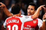 Alexis Sanchez and Santi Cazorla celebrate an Arsenal goal
