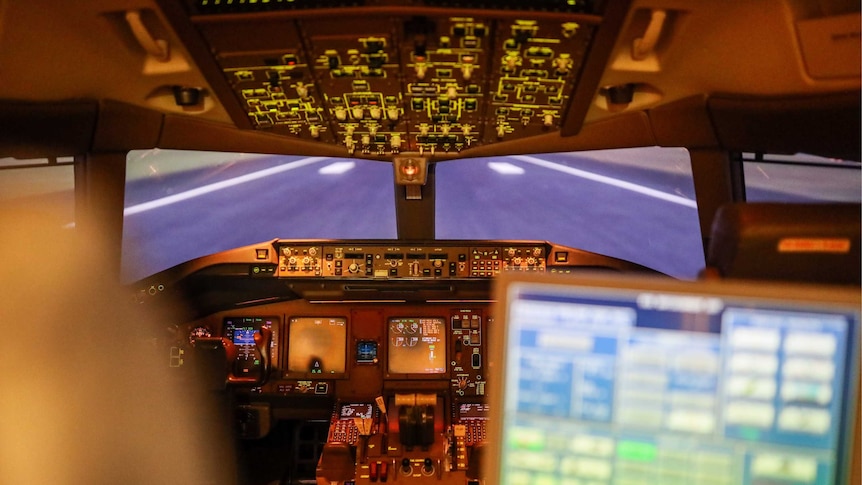 Inside an empty flight simulator.