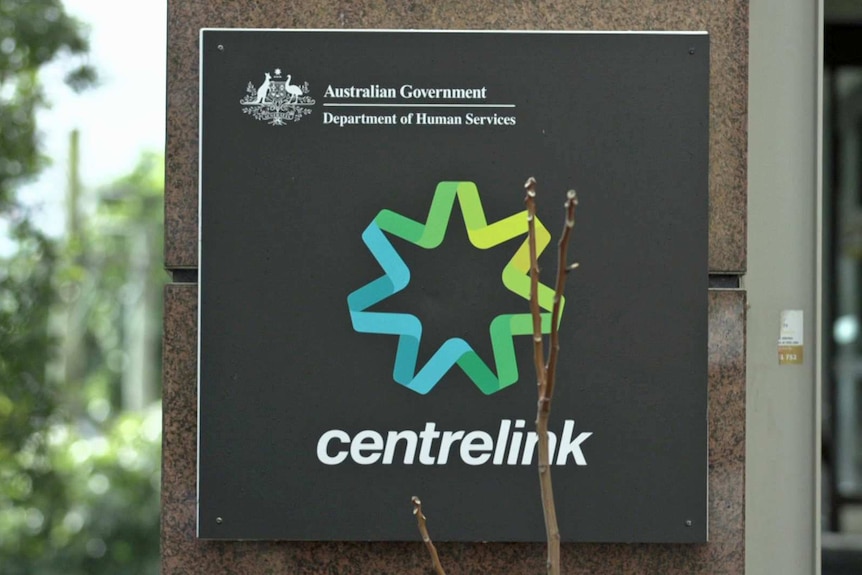 A Centrelink sign on a building.