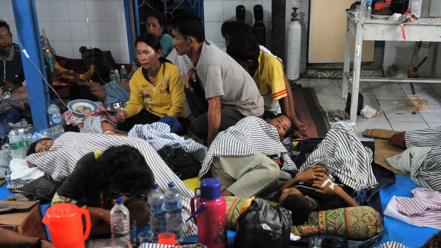 Wounded survivors receive medical treatment at a local hospital in the village of Sikakap on North Pagai island.