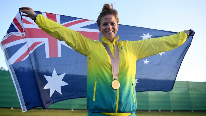 Laetisha Scanlan of Australia celebrates taking gold in the women's trap shooting final.