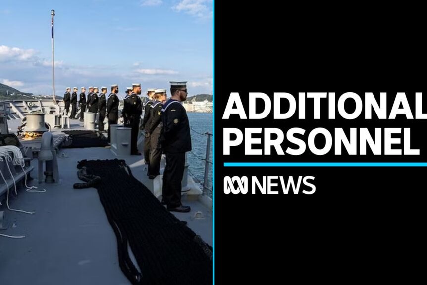 Additional Personnel: Navy sailors stand at attention on the deck of a ship