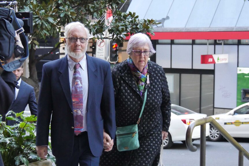 Adrian Salter and his wife walk outside court.