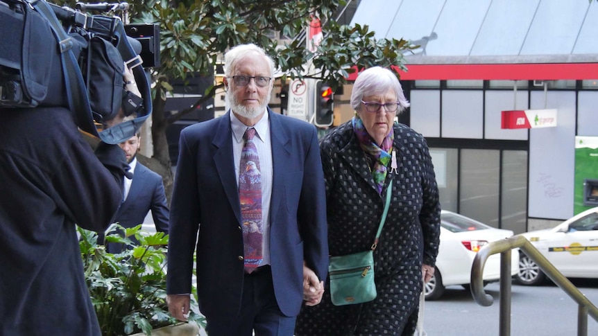 Adrian Salter and his wife walk outside court.