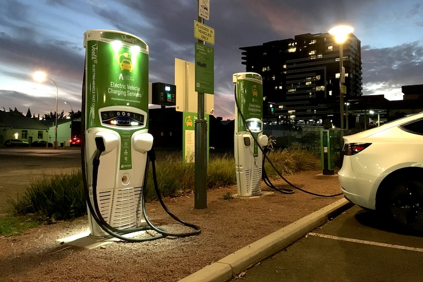 An electric vehicle charging station at dusk in Adelaide