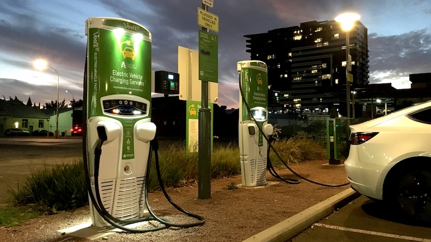 An electric vehicle charging station at dusk in Adelaide