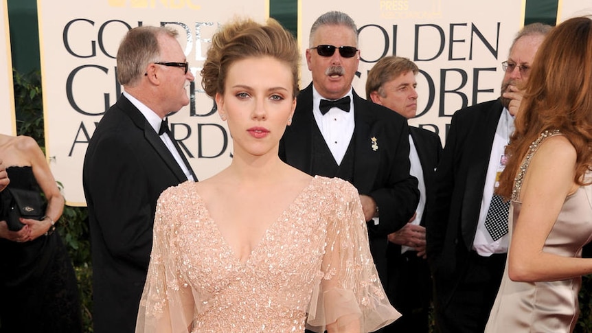 Scarlett Johansson arrives at the 2011 Golden Globes