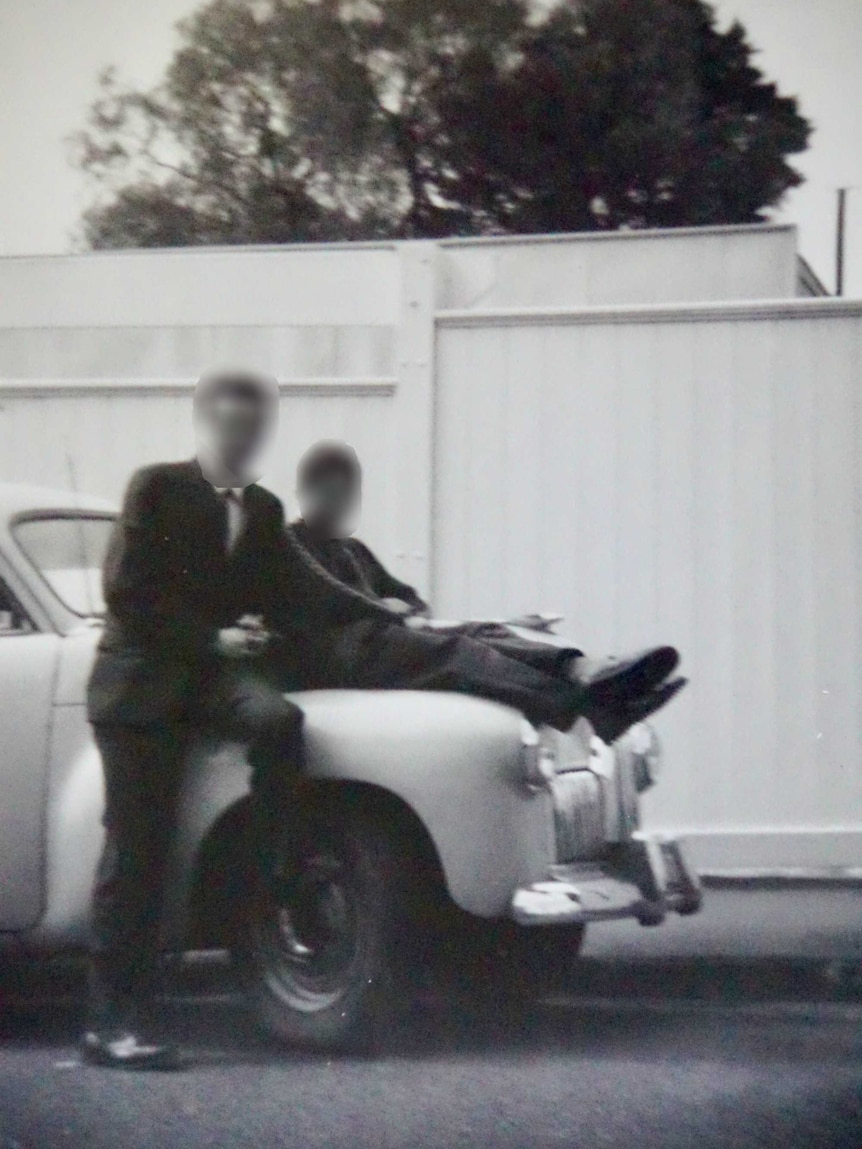 George Fletcher's abuser leans on a car.