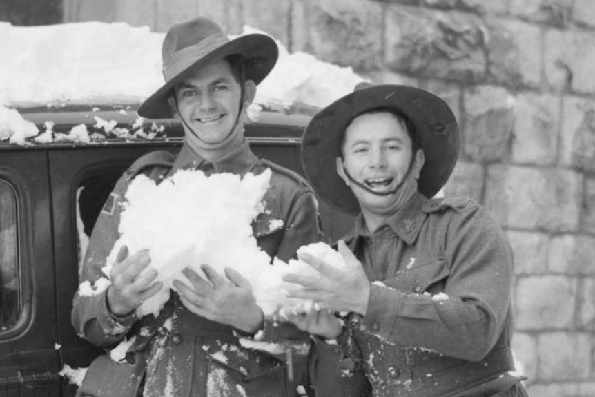 Australian soldiers and Jerusalem locals engage in a snowball fight in January, 1942.