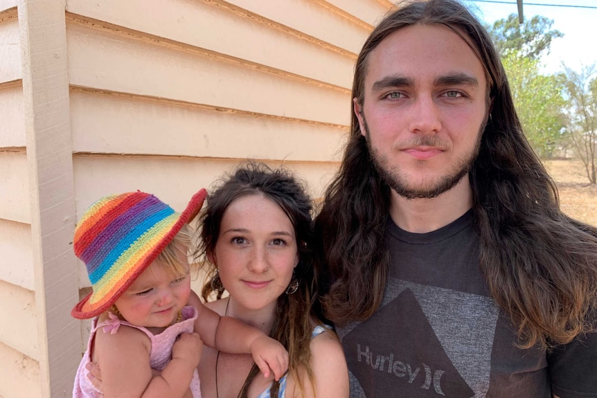 Young parents Clara and Dave Weeks with their daughter Eden at a community fire meeting in Hampton.